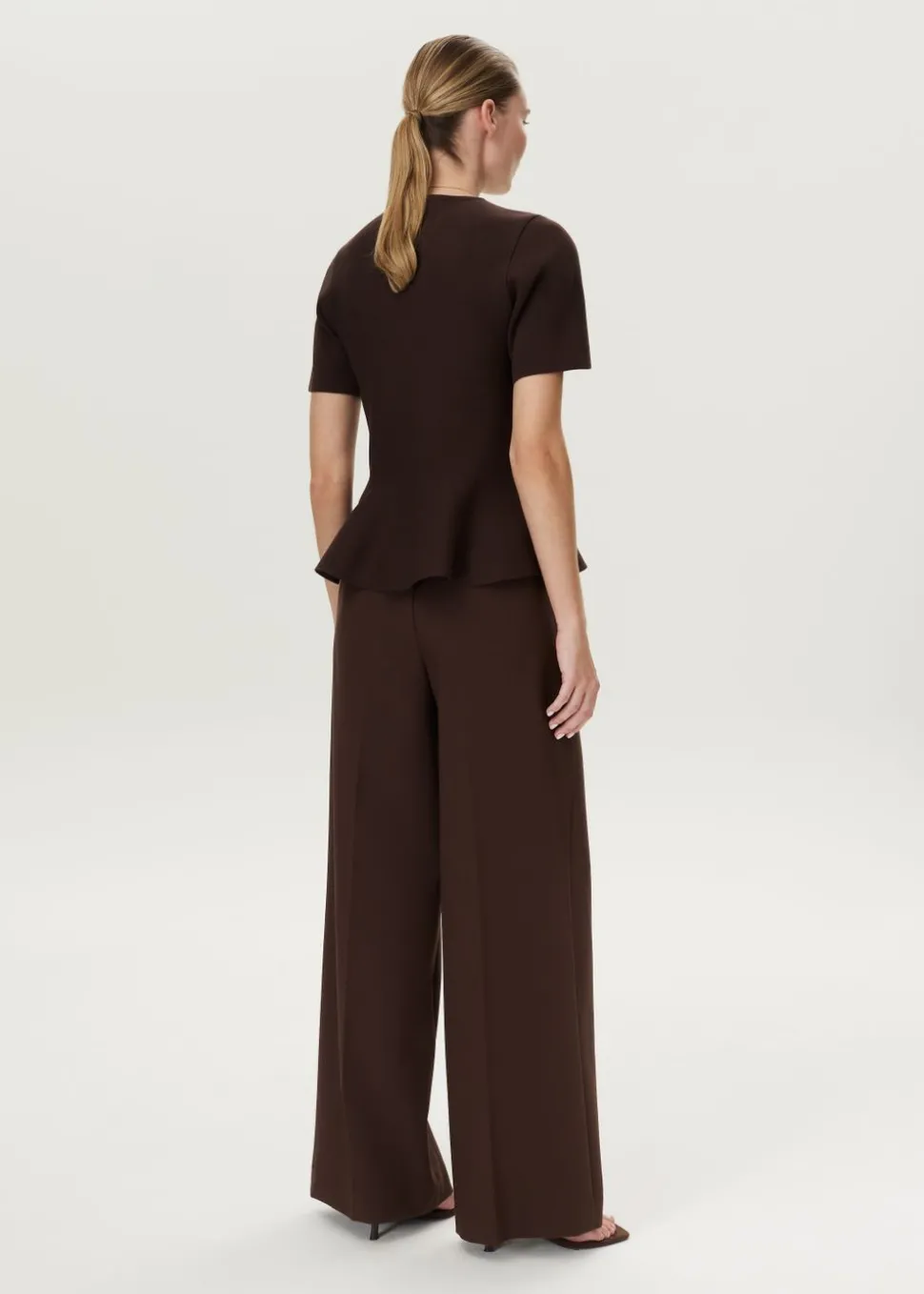 Peplum trui met ribstructuur